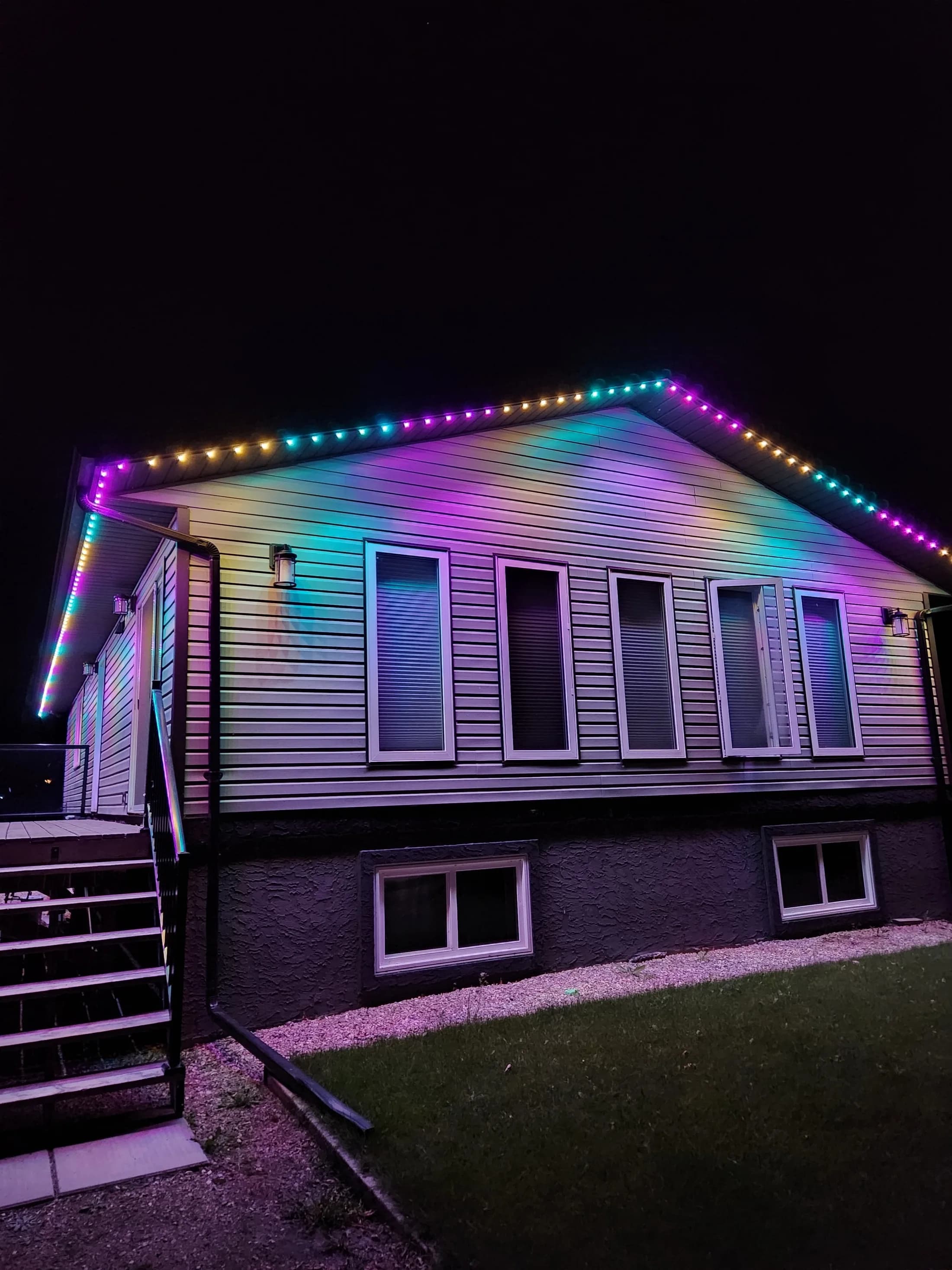 Multicolour rainbow scene running across a home's permanent LED roofline track