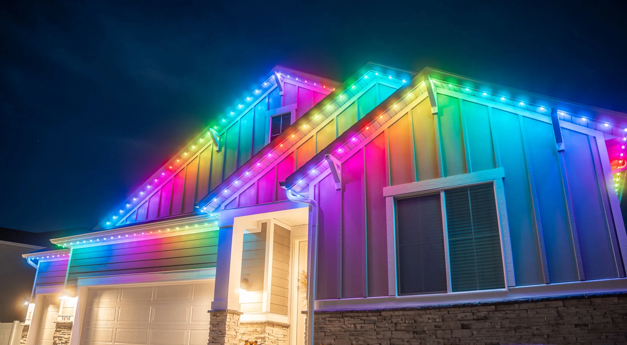 Permanent LED lighting running the full width of a building facade