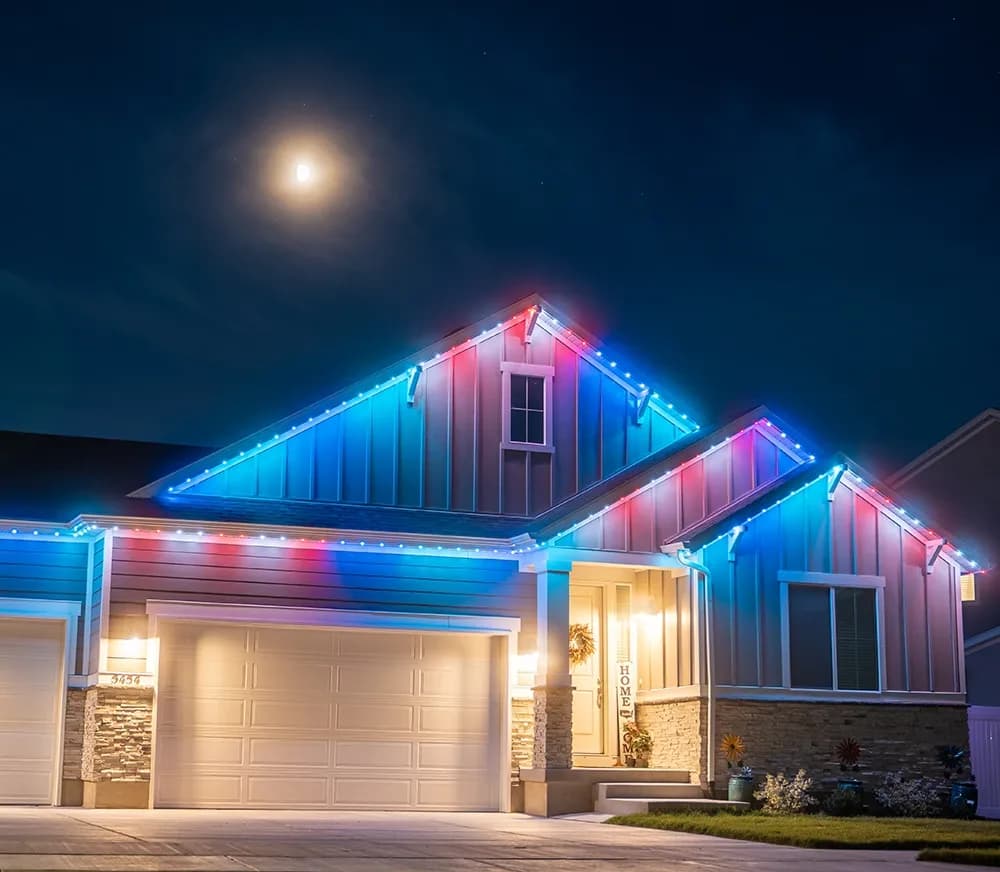 Residential street view of a home fitted with permanent LED track lighting